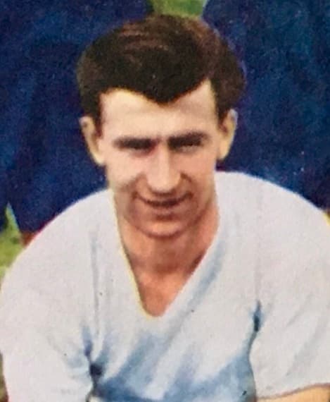 Which England captain became the first footballer in the world to win 100 international caps, reaching the milestone against Scotland in April 1959?